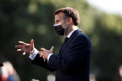 French President Emmanuel Macron speaks to the media upon his arrival at the European Union summit at Crystal Palace in Porto, Portugal, on May 8, 2021. Francisco Seco / Pool via Reuters