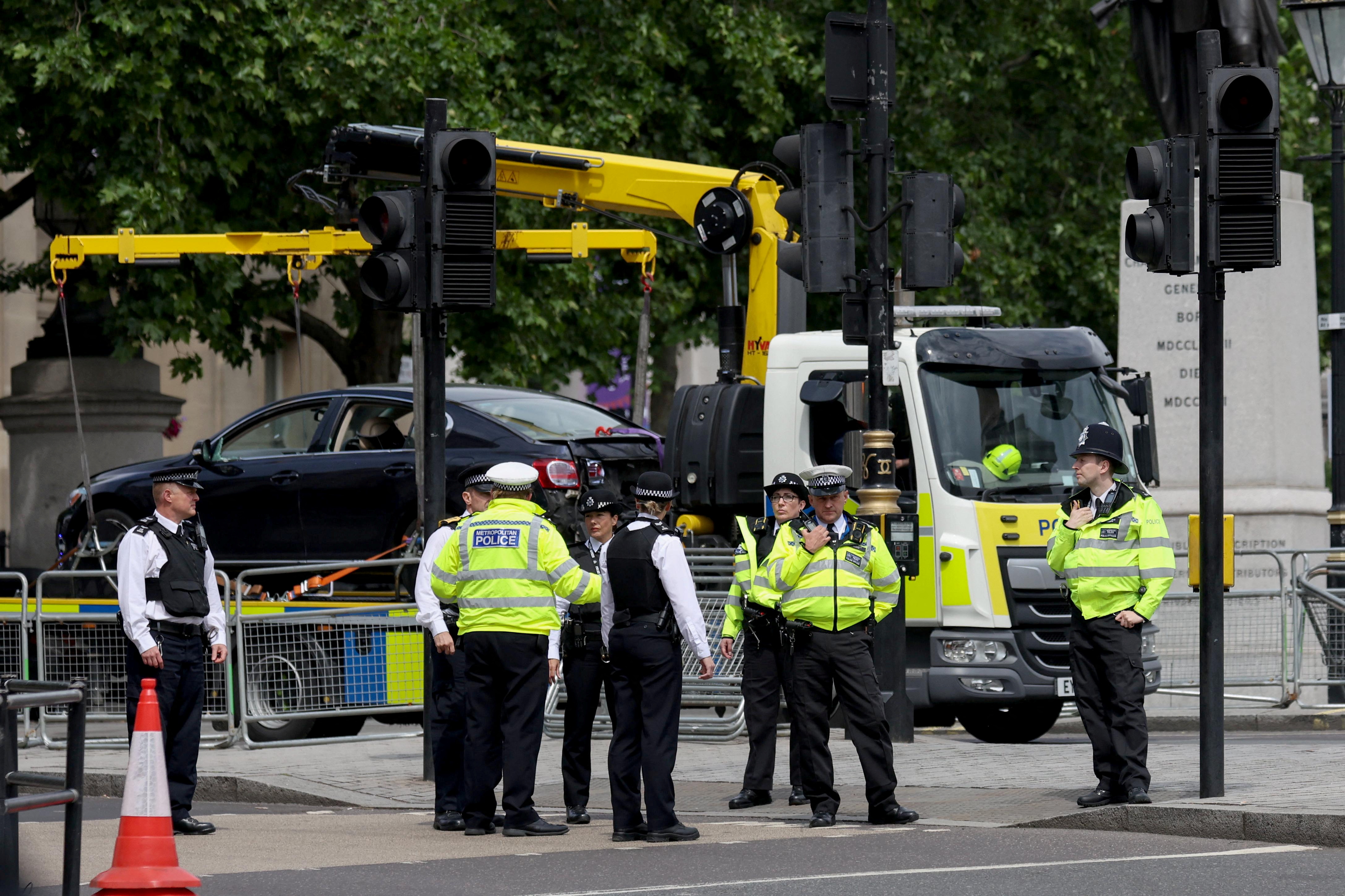 A police car clears a car after a security incident near Trafalgar Square, as Queen Elizabeth's platinum jubilee celebrations continue, in London, Britain, June 4, 2022. REUTERS/Phil Noble