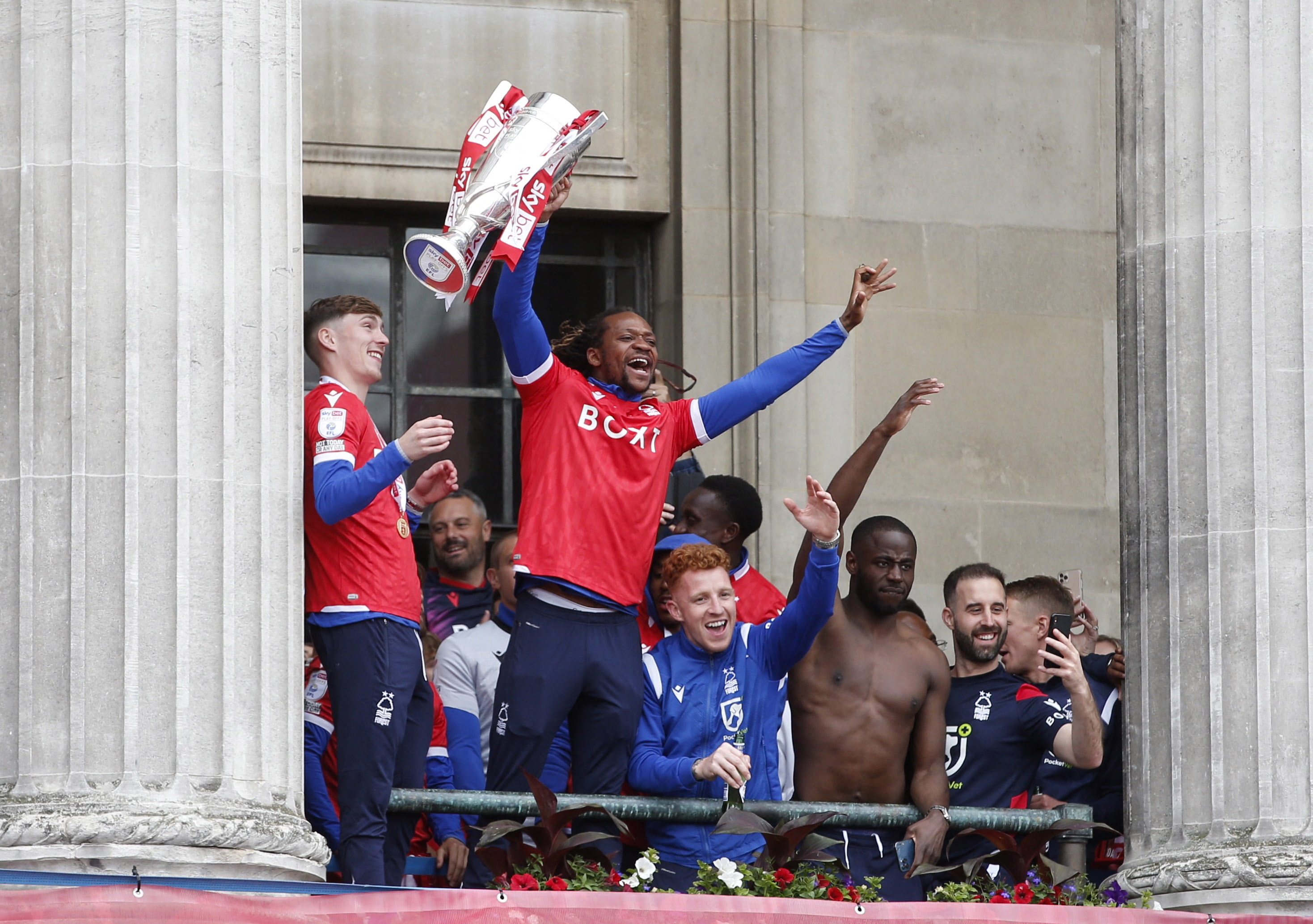 Gaetan Bong of Nottingham Forest celebrates the trophy and his teammates during the victory parade (Reuters/Ed Sykes)