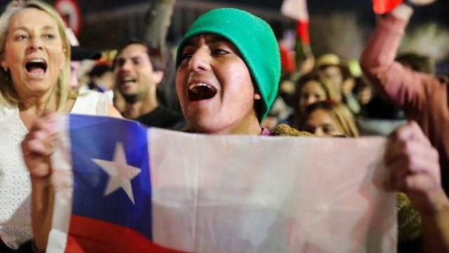 A citizen celebrates the result of the rejection of the new constitution proposal in Chile.